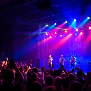 An energetic band performing on stage at a concert in Tampa