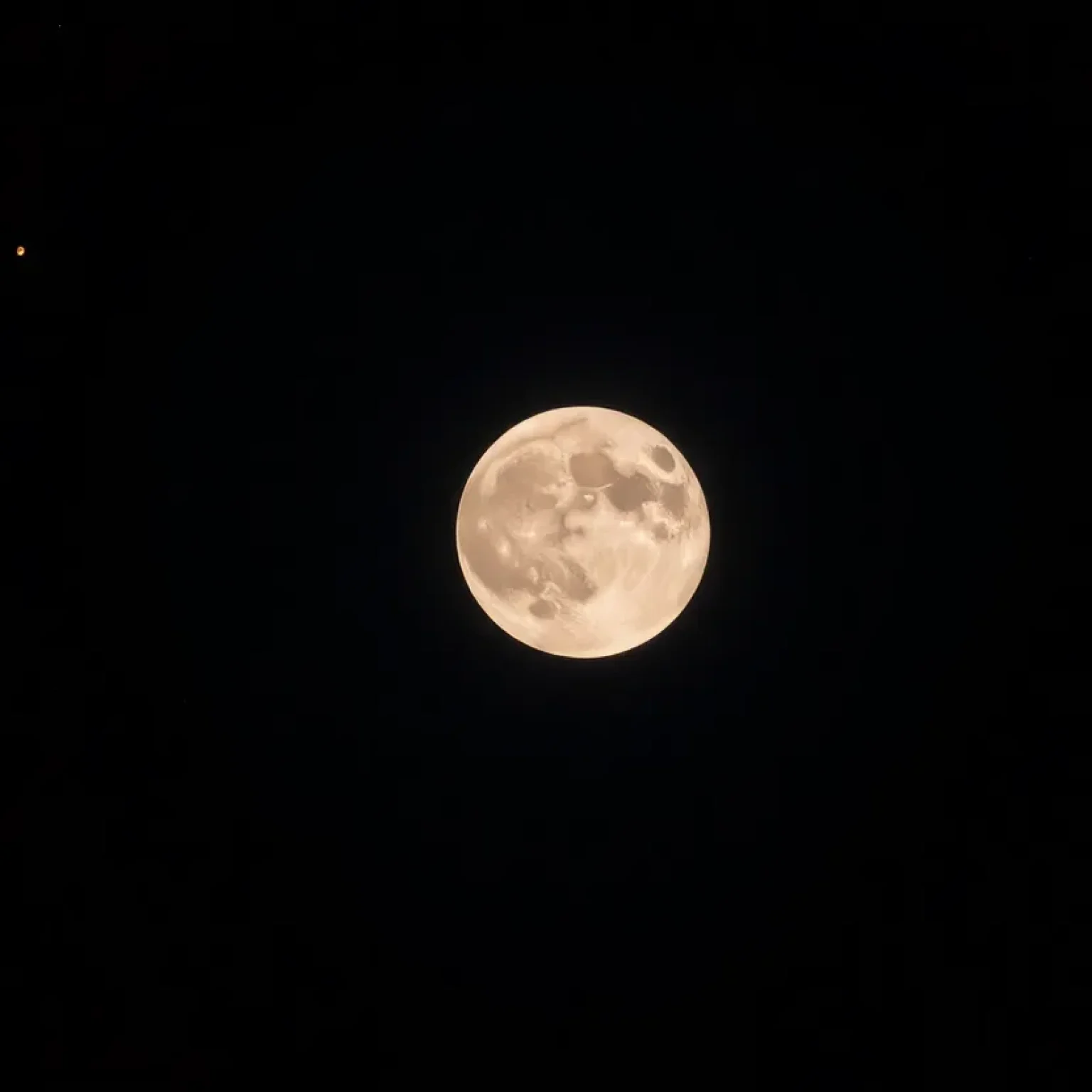 The Full Wolf Moon shining in a clear night sky