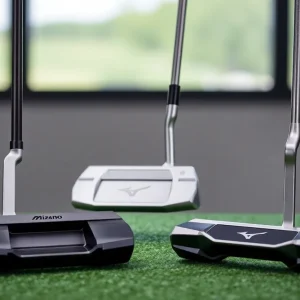 A display of Mizuno M.Craft X putters on a golf course.